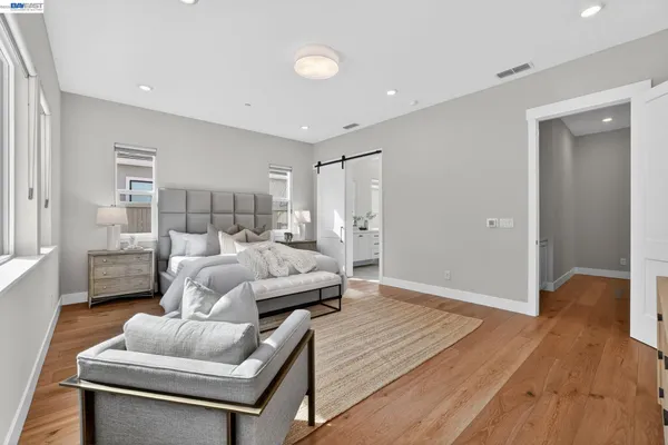 a bedroom with a bed and a bathroom