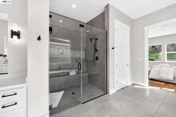 a view of a kitchen with wooden floor and electronic appliances