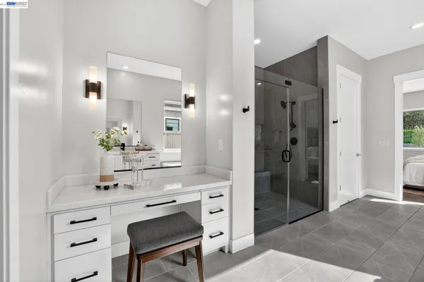 a workspace with wooden floor and a window