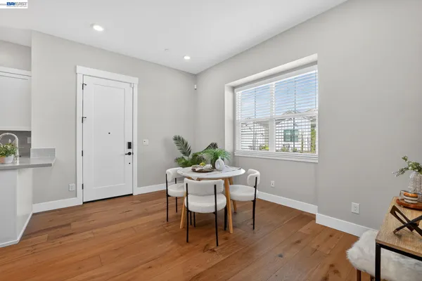 a bedroom with bed and wooden floor