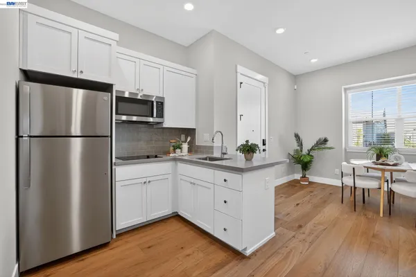 a bathroom with double vanity sink and a mirror