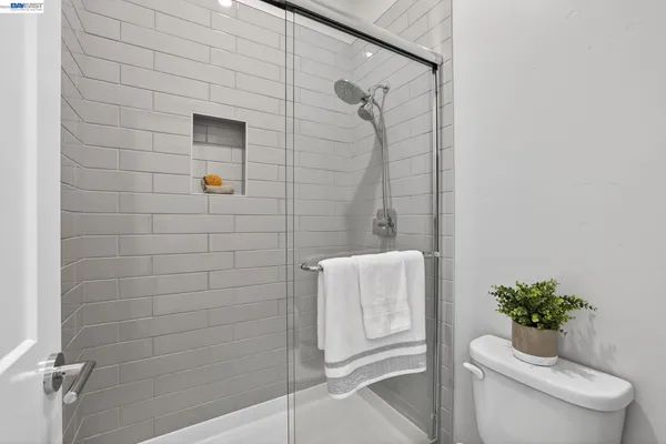 a view of house with patio entertaining space with dining table and chairs