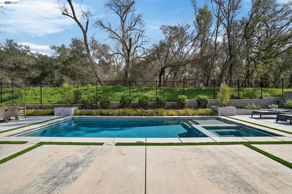 a utility room with sink dryer and washer