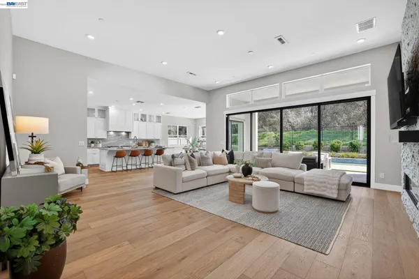 a living room with fireplace furniture and a flat screen tv