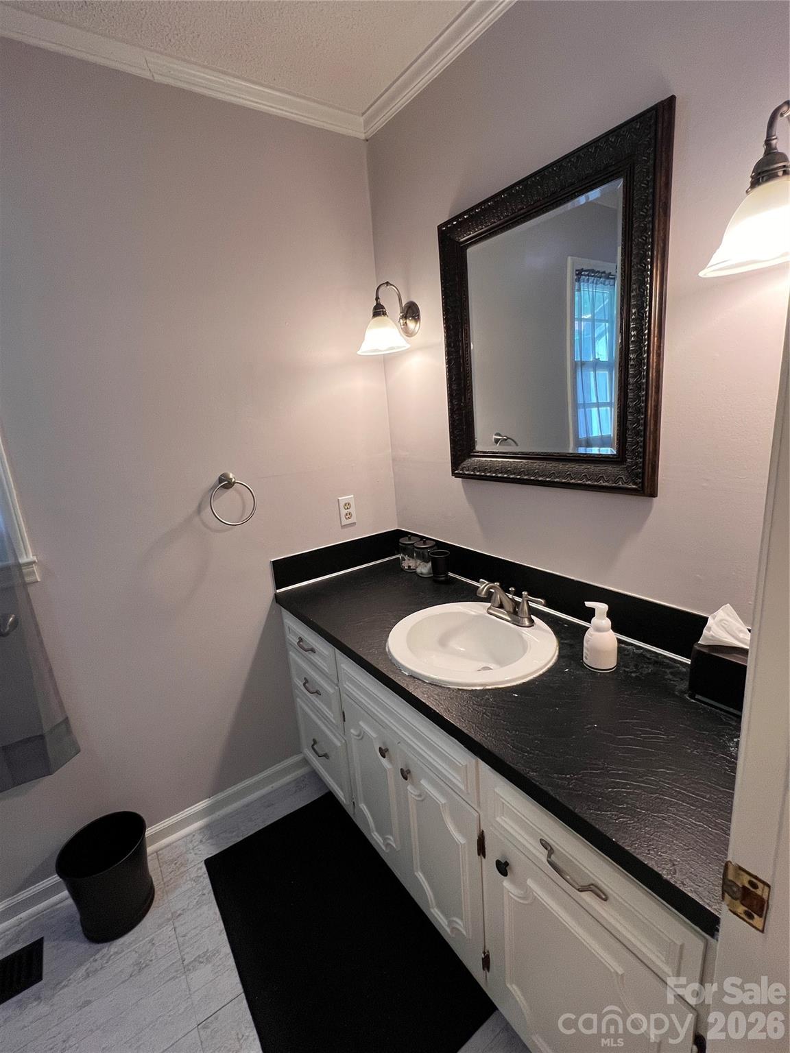 1426 Alf Hoover Road Vale, NC 28168 - Photo 15 of 35 a bathroom with a granite countertop sink and a mirror