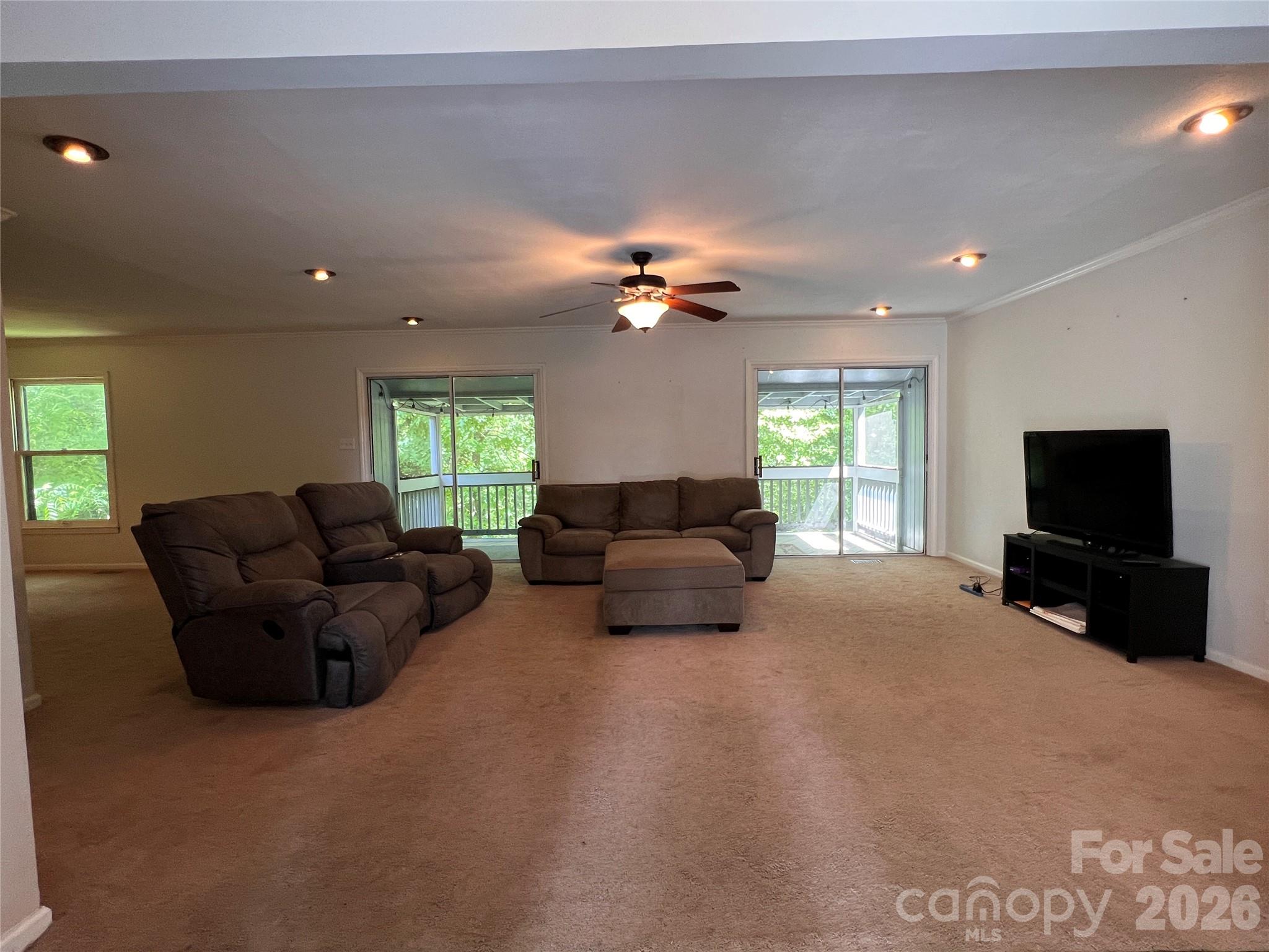 1426 Alf Hoover Road Vale, NC 28168 - Photo 3 of 35 a living room with furniture a flat screen tv and a window