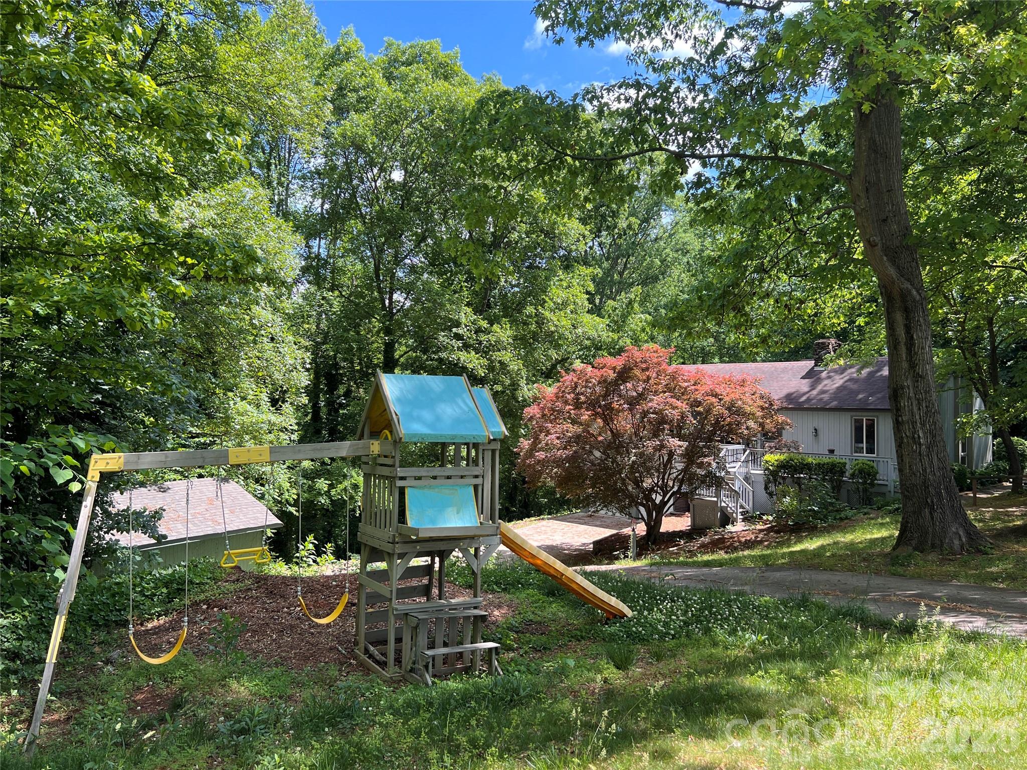 1426 Alf Hoover Road Vale, NC 28168 - Photo 35 of 35 a view of a backyard with table and chairs potted plants and large tree