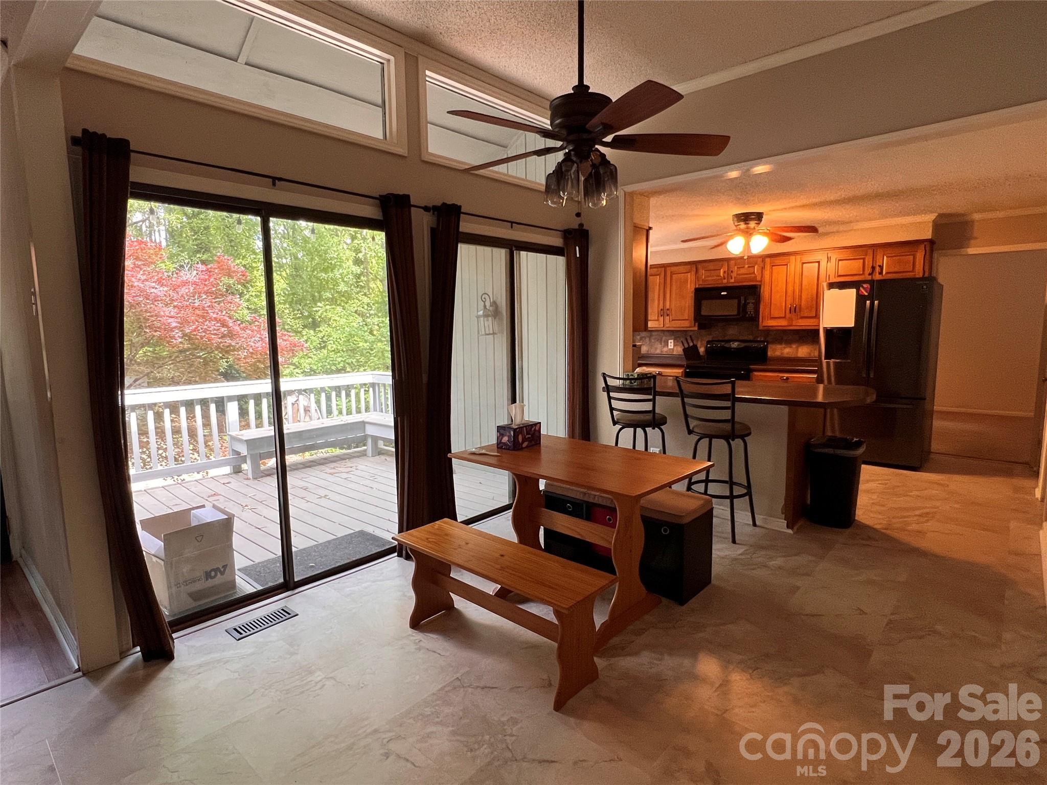 1426 Alf Hoover Road Vale, NC 28168 - Photo 9 of 35 a living room with furniture a ceiling fan and a large window
