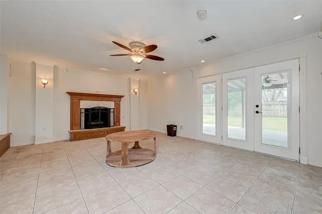 a view of an empty room with a fireplace