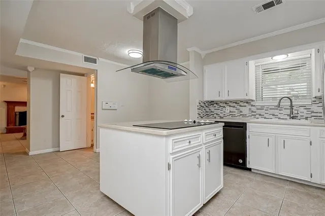a kitchen with granite countertop a sink and a stove