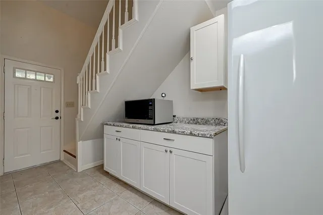 a kitchen with a stove and a microwave