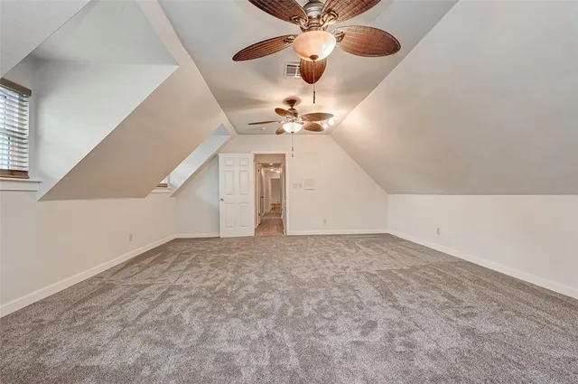 a view of a big room with carpet