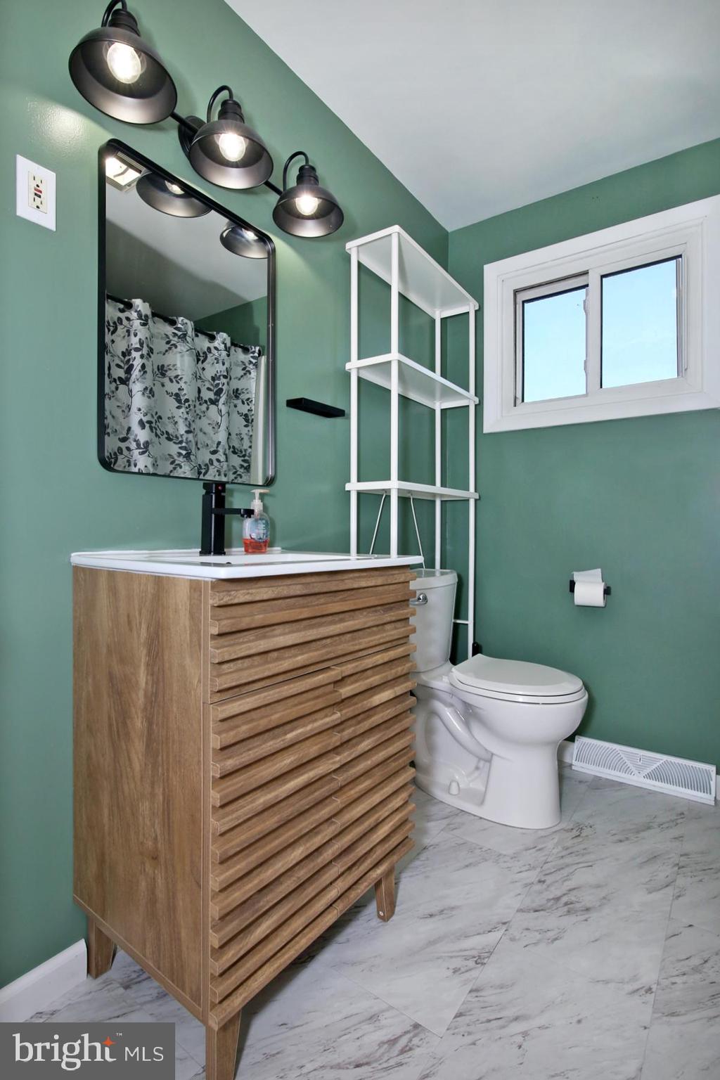 1217 Broadway Boulevard Reading, PA 19607 - Photo 17 of 35 a bathroom with a toilet and a sink
