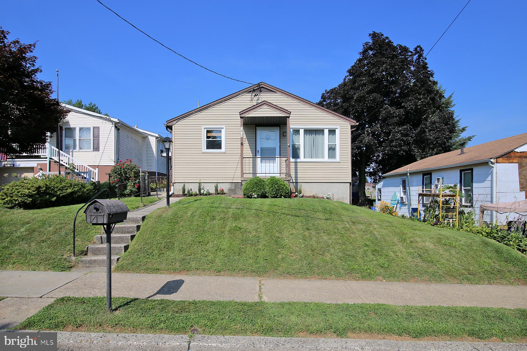 1217 Broadway Boulevard Reading, PA 19607 - Photo 2 of 35 a front view of a house with garden