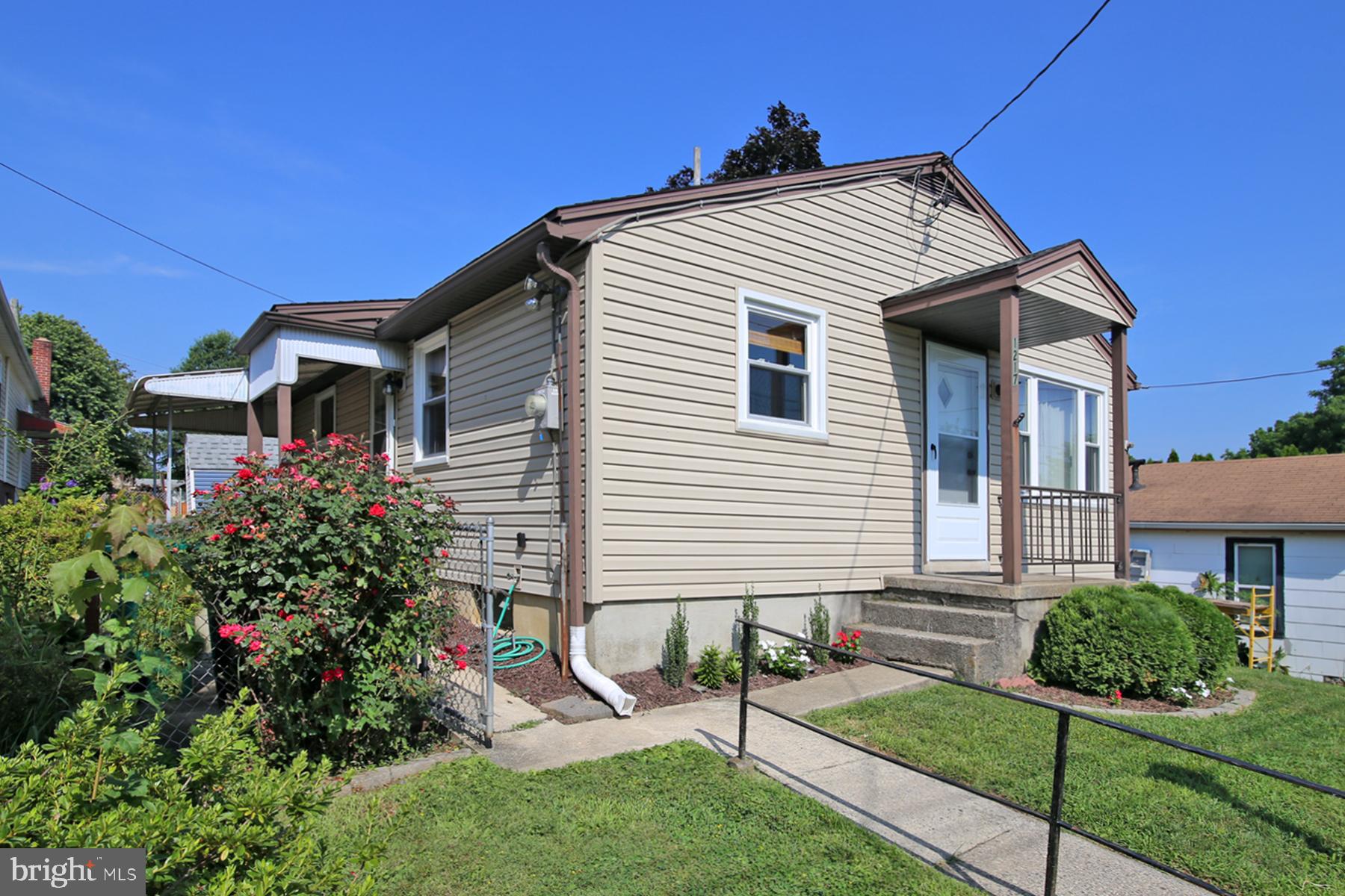 1217 Broadway Boulevard Reading, PA 19607 - Photo 33 of 35 a front view of a house with garden