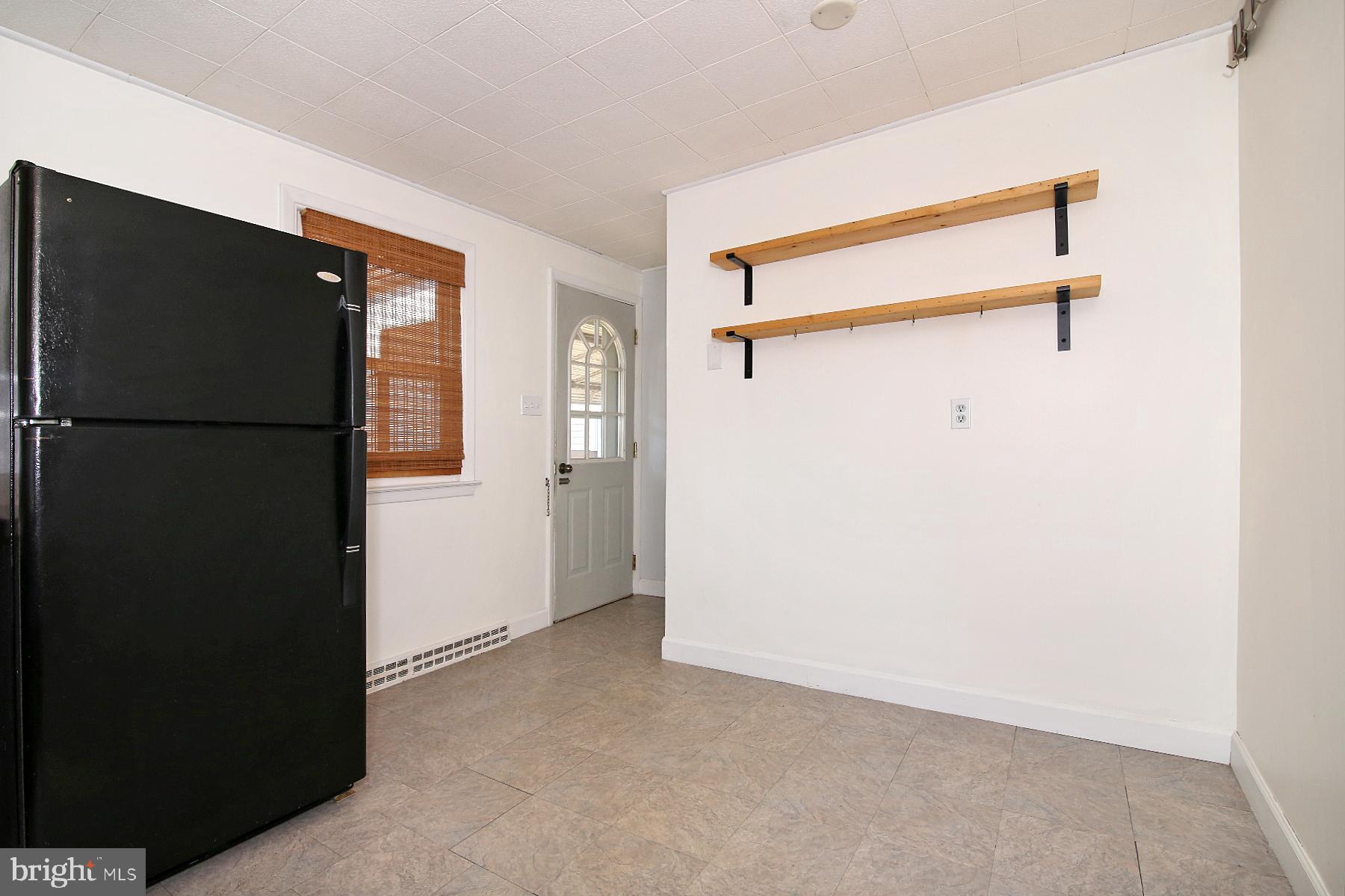 1217 Broadway Boulevard Reading, PA 19607 - Photo 6 of 35 a view of a refrigerator in kitchen and a window