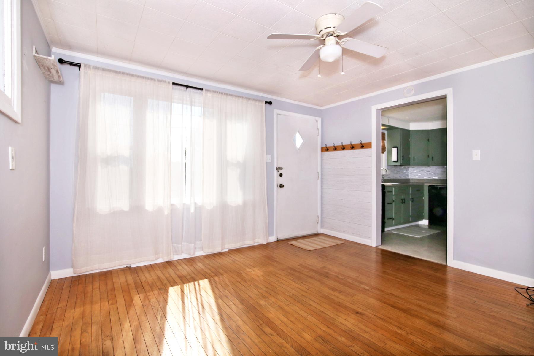1217 Broadway Boulevard Reading, PA 19607 - Photo 7 of 35 wooden floor in an empty room with a window