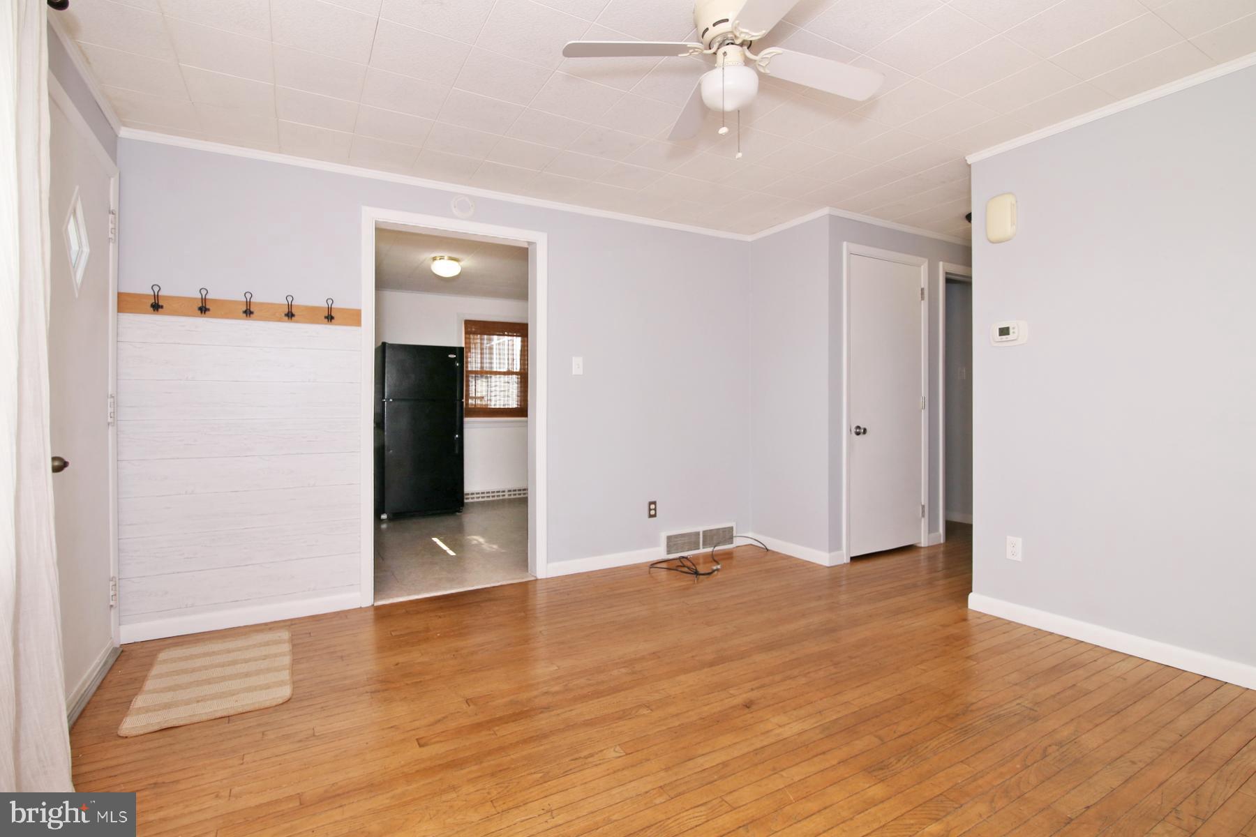 1217 Broadway Boulevard Reading, PA 19607 - Photo 9 of 35 wooden floor in an empty room with a window