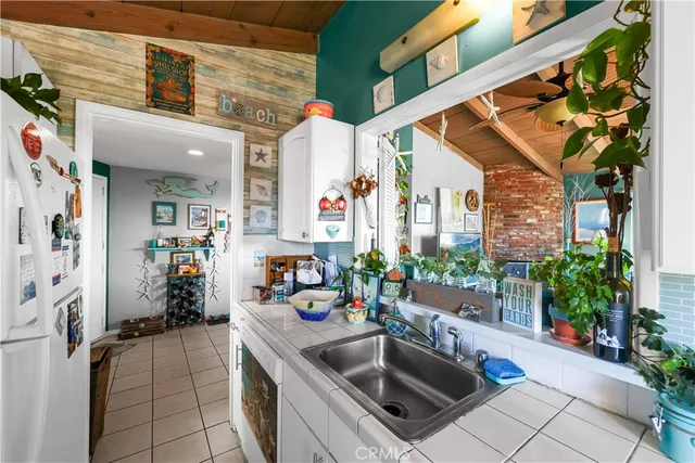 a kitchen with stainless steel appliances granite countertop a sink and a stove