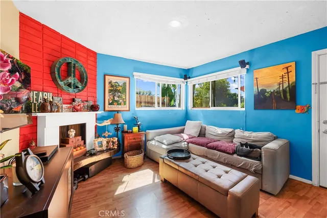 a living room with furniture and kitchen view
