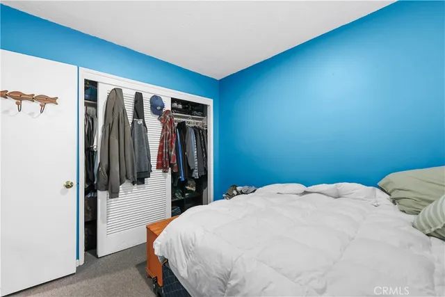a view of a dry yard with wooden fence