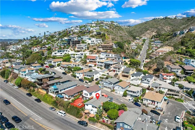 an aerial view of residential houses with outdoor space