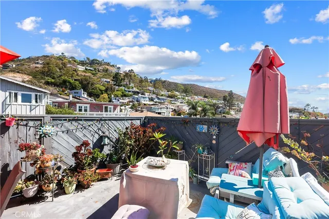 a view of a chairs and table in a balcony
