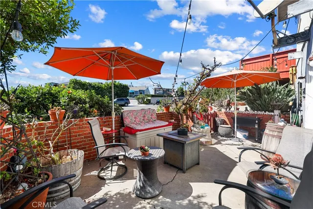 an outdoor space with patio furniture and umbrella