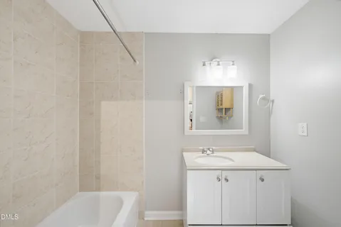 a bathroom with a sink a vanity and a mirror