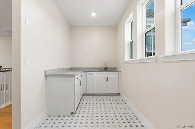 a view of walk in closet with white walls