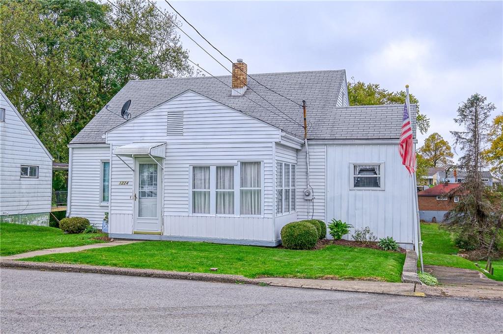 1224 Eckert Road Monaca, PA 15061 - Photo 1 of 18 a front view of a house with a yard and plants