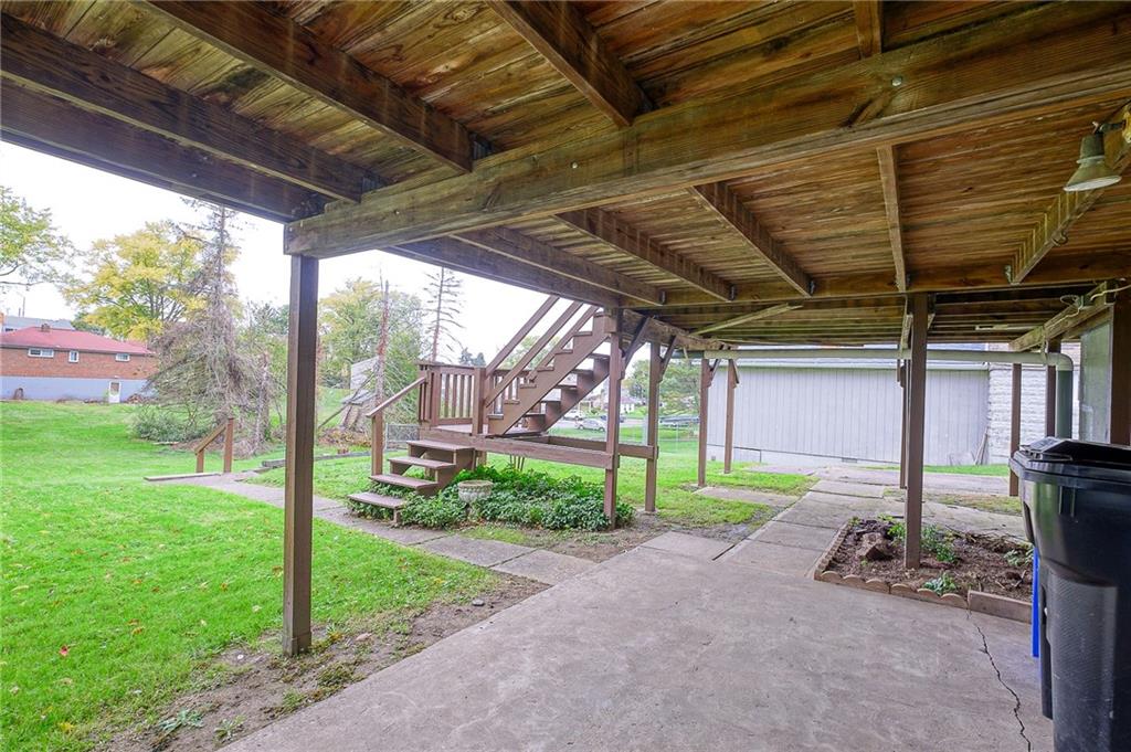 1224 Eckert Road Monaca, PA 15061 - Photo 16 of 18 a view of a porch with furniture and a yard
