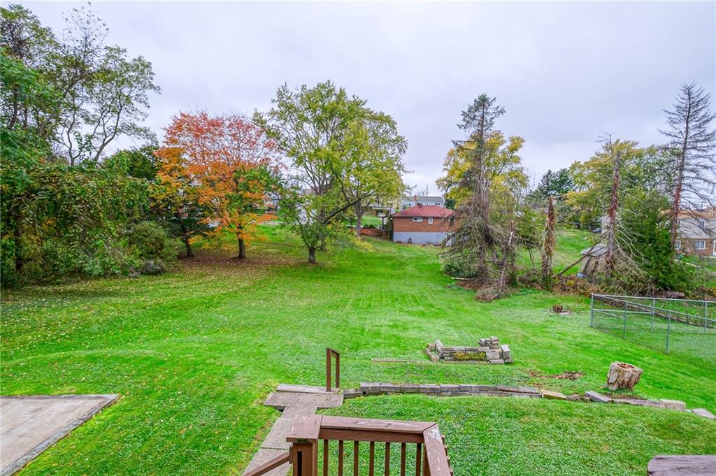 1224 Eckert Road Monaca, PA 15061 - Photo 17 of 18 a backyard of a house with table and chairs
