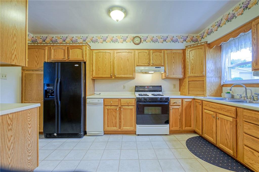 1224 Eckert Road Monaca, PA 15061 - Photo 5 of 18 a kitchen with stainless steel appliances granite countertop a refrigerator and a sink