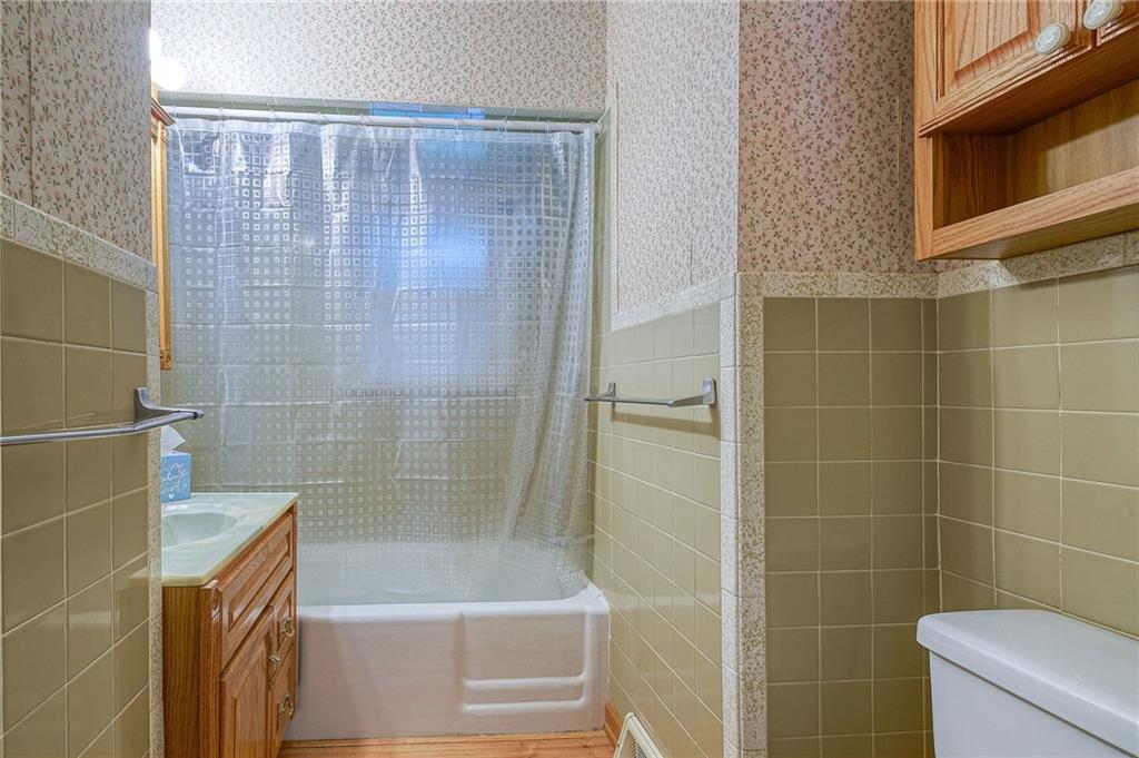 1224 Eckert Road Monaca, PA 15061 - Photo 8 of 18 a bathroom with a shower and a bathtub