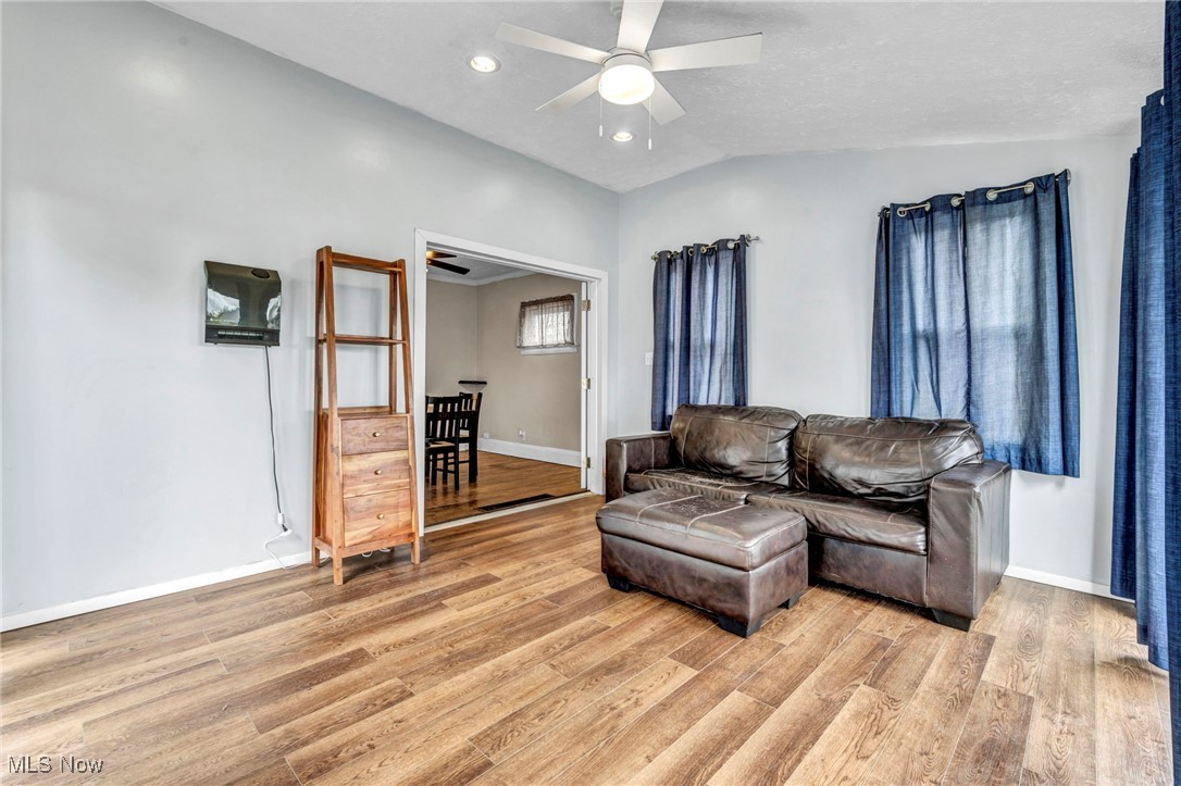 14725 Alger Road Cleveland, OH 44111 - Photo 12 of 40 family room featuring light hardwood / wood-style flooring, ceiling fan, and vaulted ceiling