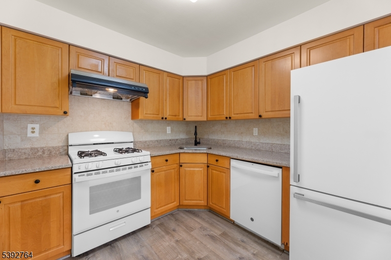 65 Diamond Lane Old Bridge, NJ 08857 - Photo 12 of 33 a kitchen with granite countertop cabinets stainless steel appliances and a sink
