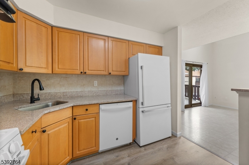 65 Diamond Lane Old Bridge, NJ 08857 - Photo 13 of 33 a white refrigerator freezer sitting in a kitchen