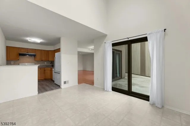 a view of a kitchen with a sink and cabinets