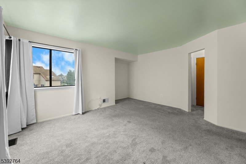 65 Diamond Lane Old Bridge, NJ 08857 - Photo 16 of 33 a view of an empty room with a window