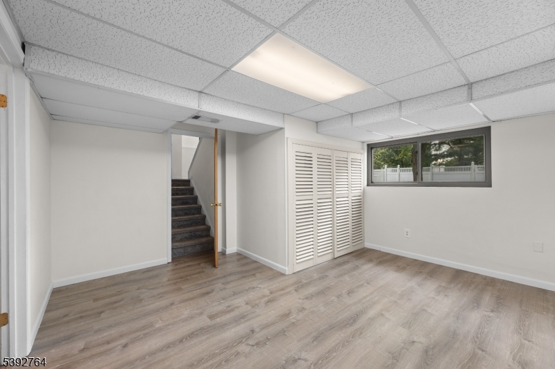 65 Diamond Lane Old Bridge, NJ 08857 - Photo 21 of 33 an empty room with wooden floor and windows