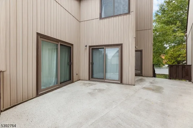 an empty room with windows and yard