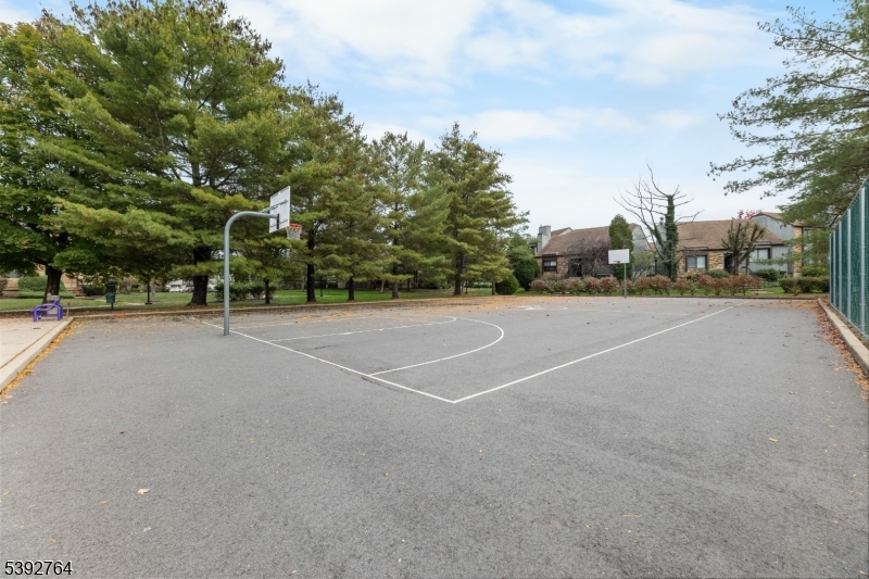 65 Diamond Lane Old Bridge, NJ 08857 - Photo 32 of 33 a view of a tennis ground with trees in the background