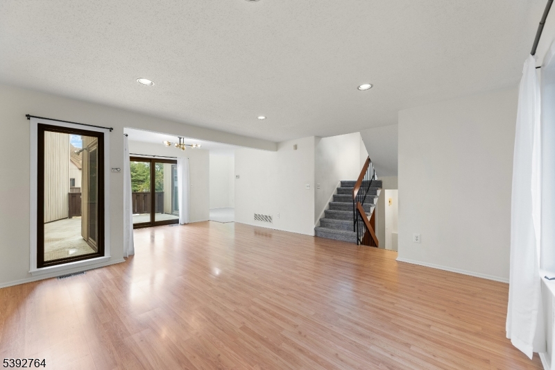65 Diamond Lane Old Bridge, NJ 08857 - Photo 4 of 33 a view of empty room with wooden floor and fan