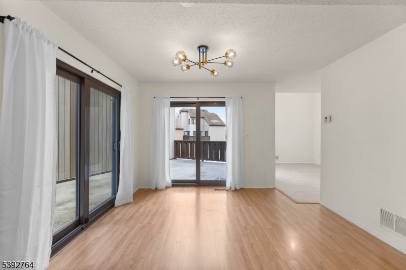 65 Diamond Lane Old Bridge, NJ 08857 - Photo 9 of 33 wooden floor in an empty room with a window