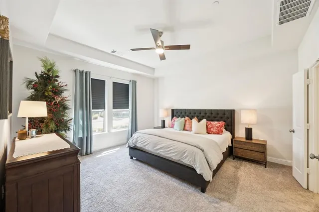 a bedroom with a bed and a dresser