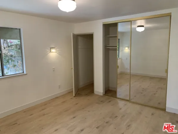 wooden floor and closet in a room