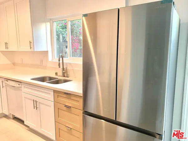a kitchen with a stove and a sink