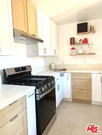 a kitchen with a sink and a window