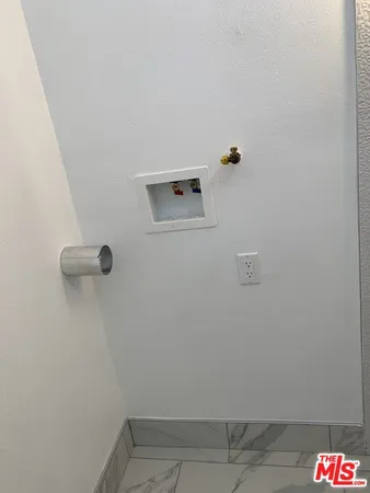 a view of bathroom with a shower and mirror